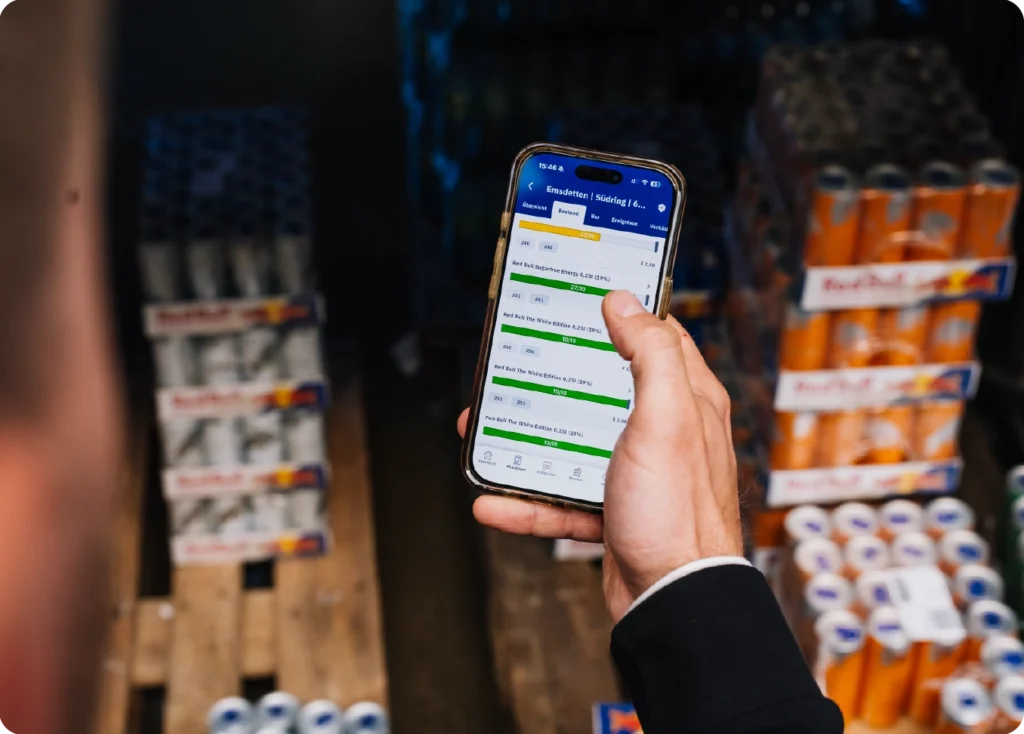 Vendon Cloud stock-level overview displayed on a mobile device inside Hensing’s vending warehouse